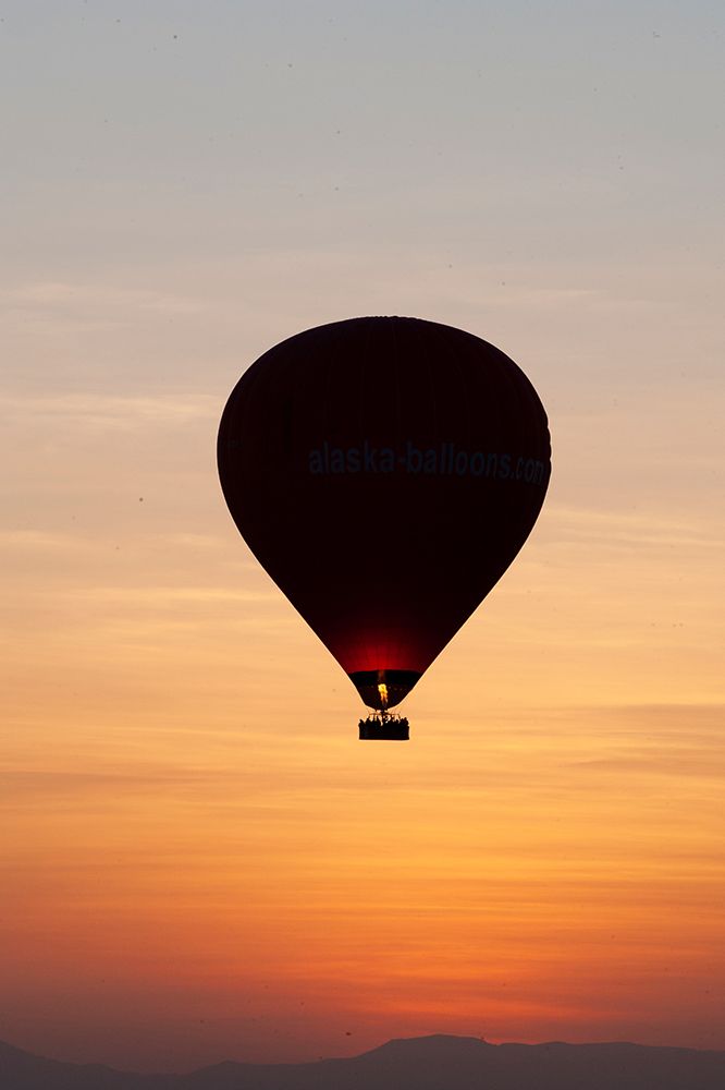 Africa, Egypt, Luxor. Hot air balloons travel over the Valley of the Kings at sunrise.